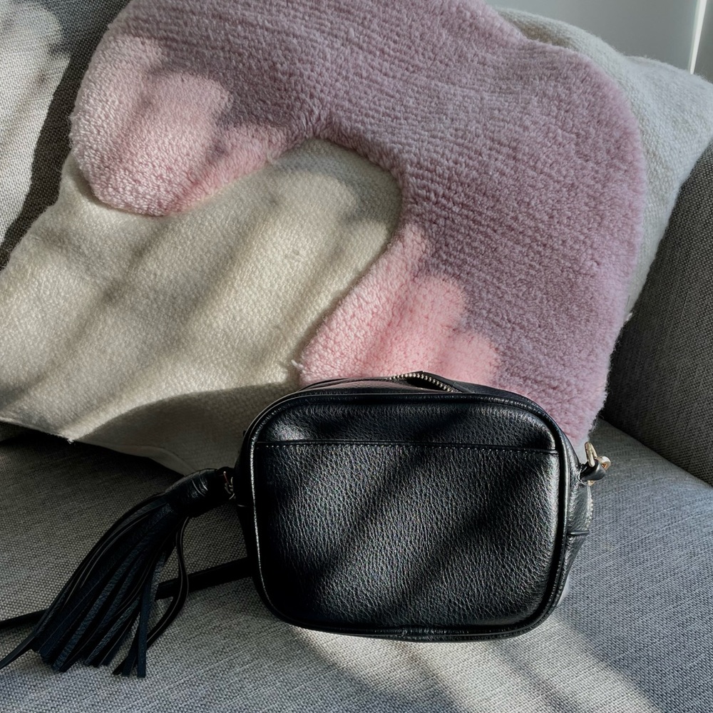 Anthropologie black cross body with tassel detail